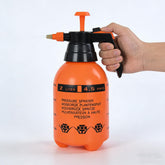 DCdray pulverizador frente naranja mostrando diseño y empuñadura ergonómica