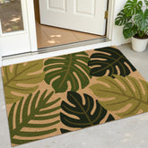 DEXI felpudo frontal Monstera mostrando bienvenida y captura de suciedad