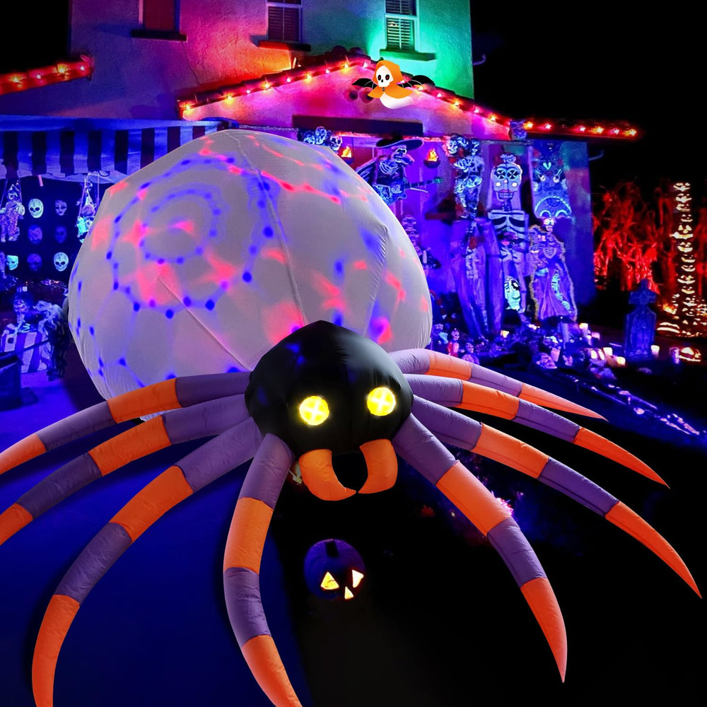 DomKom araña inflable vista frontal grande destacando su presencia y efecto nocturno