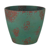 GROWSCAPE maceta Vogue frontal en cobre pátina mostrando diseño elegante y práctico