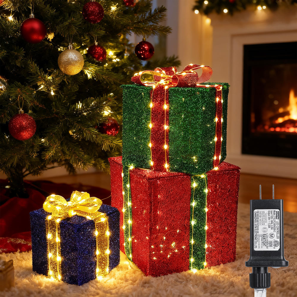 Jyoiat vista frontal de las tres cajas regalo iluminadas con ambiente cálido