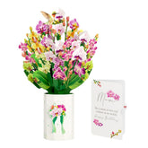 Lovepop ramo frontal mostrando orquídeas desplegadas y belleza duradera