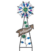 TERESA'S COLLECTIONS vista frontal del spinner azul y letrero welcome, aporta bienvenida visual