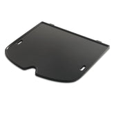 Weber plancha Traveler vista frontal mostrando área de cocción y ajuste seguro
