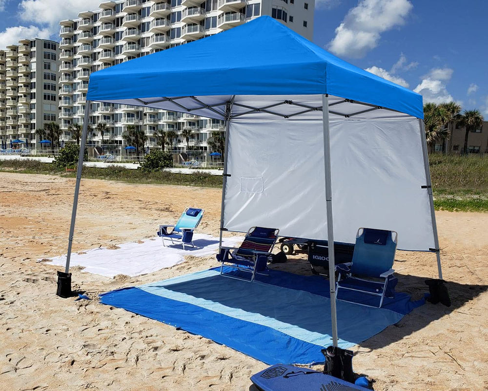 ABCCANOPY comparación de tamaño del toldo junto a toallas para referencia de escala