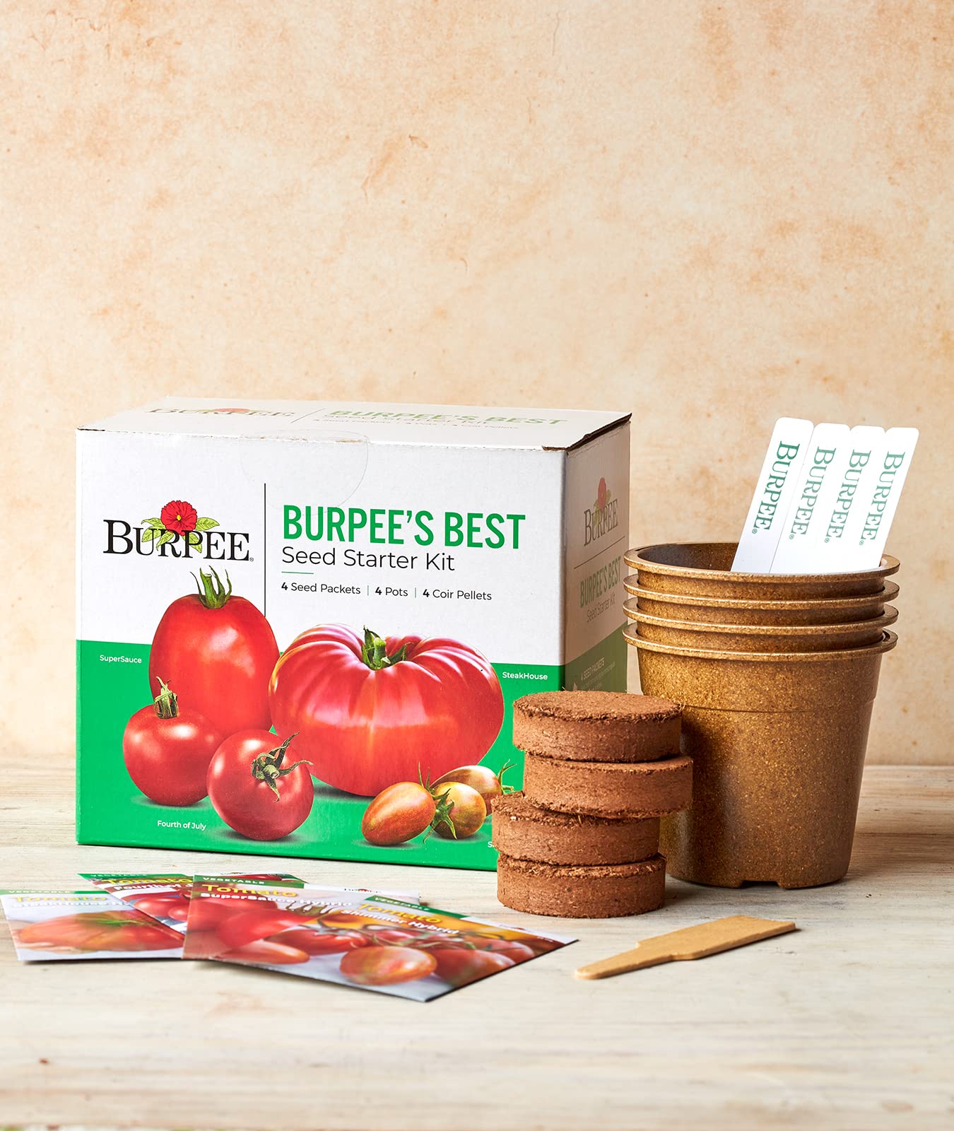 Burpee kit en uso: manos plantando semillas en interiores para germinación segura
