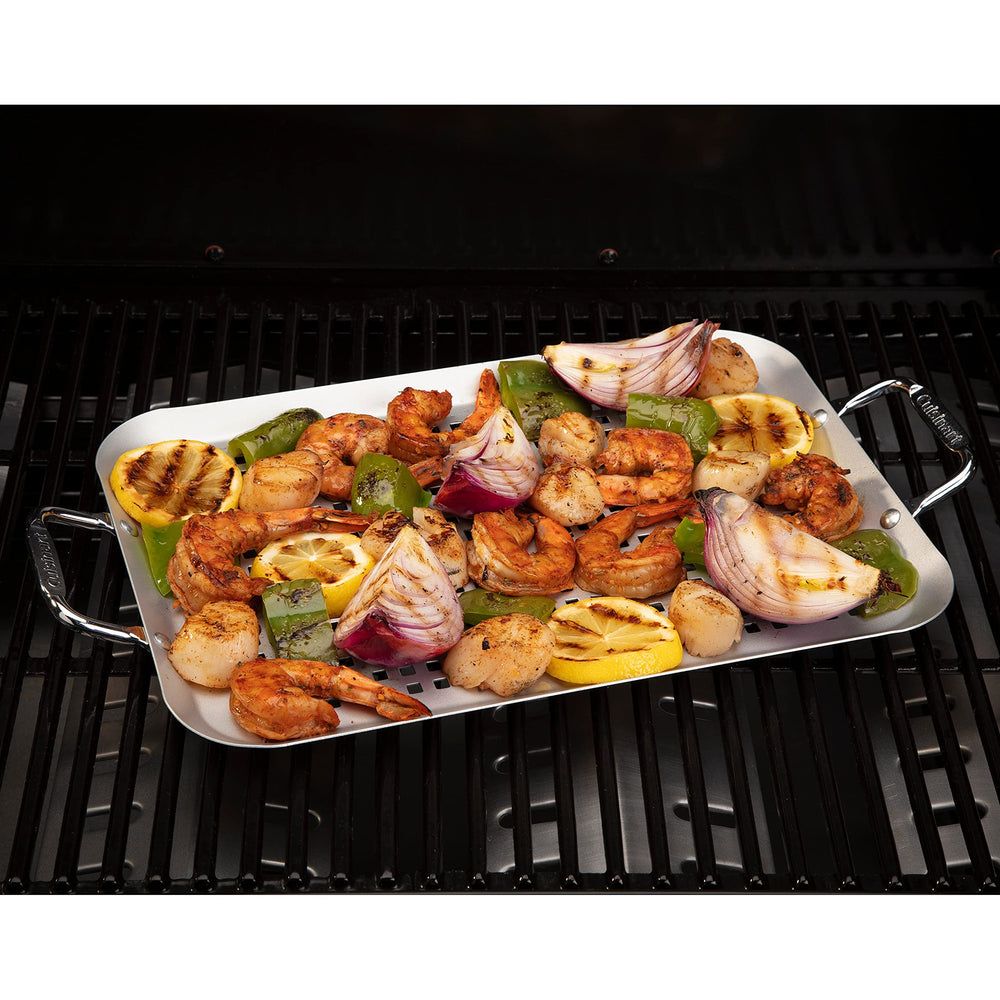 Cuisinart CNP-650 en parrilla con verduras y pescado, cocina uniforme y limpia