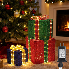 Jyoiat vista frontal de las tres cajas regalo iluminadas con ambiente cálido
